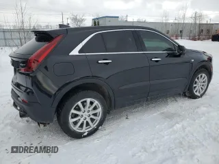 2022 Cadillac XT4 FWD Luxury z VIN 1GYAZAR48NF163967, wystawiony jako Copart lot #43148925 z przebiegiem 58 788 mil mil oraz Czysty tytuł • Clean title. Historia ofert i sprzedaży dostępna na DreamBid. Obrazek 3.