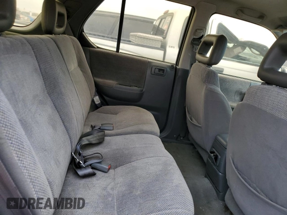 1999 Isuzu Rodeo S with VIN 4S2CK58W9X4322074, listed as a Copart auction lot 76999244 with 110,142 mi miles and Salvage Title. Bid and sale history available at carsss.com. Image 10.