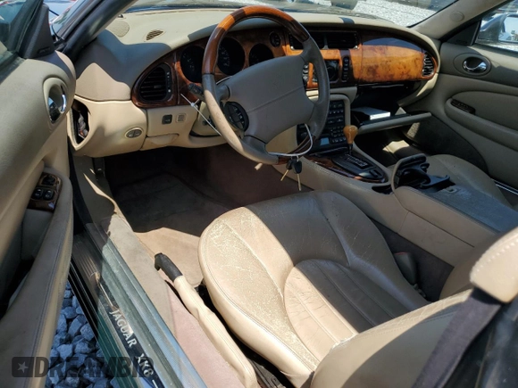 2002 Jaguar XK with VIN SAJDA42C62NA25816, listed as a Copart auction lot 52802525 with Not Provided miles and Salvage Title. Bid and sale history available at DreamBid. Image 8.