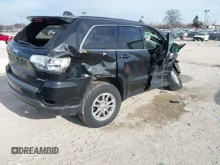 2018 Jeep Grand Cherokee Laredo E with VIN 1C4RJFAG7JC244103, listed as a IAAI auction lot 41260642 with 116,797 mi miles. Bid and sale history available at carsss.com. Image 4.