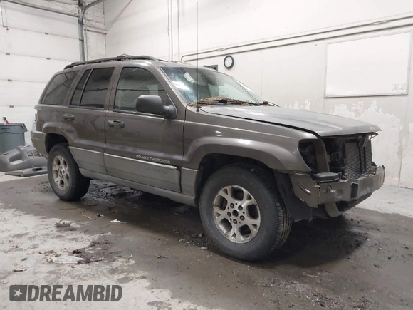 1999 Jeep Grand Cherokee Laredo with VIN 1J4GW58SXXC584734, listed as a IAAI auction lot 41902224 with 209,180 mi miles and . Bid and sale history available at DreamBid. Image 1.