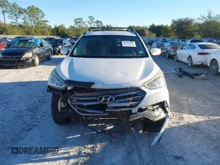 2017 Hyundai Santa Fe 2.4L z VIN 5XYZU3LB4HG435992, wystawiony jako IAAI lot #40927607 z przebiegiem 104 868 mil mil oraz . Historia ofert i sprzedaży dostępna na DreamBid. Obrazek 13.