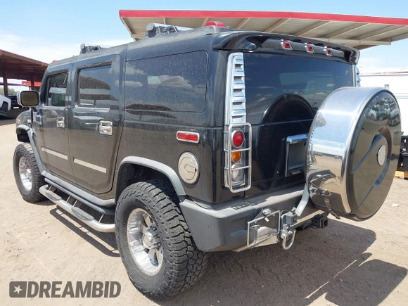 2003 Hummer H2 with VIN 5GRGN23U73H122756, listed as a IAAI auction lot 42194176 with 239,411 mi miles. Bid and sale history available at carsss.com. Image 3.
