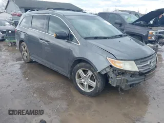2011 Honda Odyssey Touring with VIN 5FNRL5H95BB007514, listed as a IAAI auction lot 41402516 with 281,032 mi miles and . Bid and sale history available at DreamBid. Image 1.