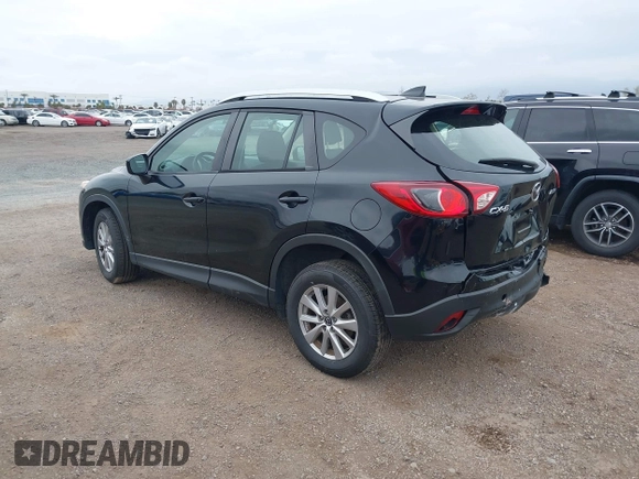 2016 Mazda CX-5 Sport with VIN JM3KE2BY4G0761933, listed as a IAAI auction lot 41709274 with 131,127 mi miles. Bid and sale history available at carsss.com. Image 3.