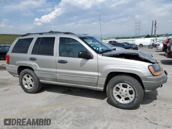 2000 Jeep Grand Cherokee Laredo with VIN 1J4GW48N1YC324356, listed as a Copart auction lot 62011305 with 242,322 mi miles and Salvage title. Bid and sale history available at DreamBid. Image 4.
