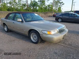 1999 Mercury Grand Marquis LS with VIN 2MEFM75W1XX703878, listed as a IAAI auction lot 42074187 with 56,962 mi miles and . Bid and sale history available at DreamBid. Image 1.