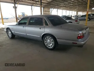 2000 Jaguar XJ with VIN SAJDA25B8YMF04079, listed as a Copart auction lot 50592595 with 131,647 mi miles and Salvage title. Bid and sale history available at DreamBid. Image 2.