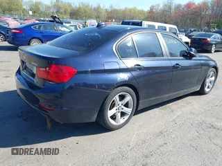 2013 BMW 3 Series 328i xDrive with VIN WBA3B3G54DNR80235, listed as a IAAI auction lot 42105883 with 144,023 mi miles. Bid and sale history available at carsss.com. Image 4.