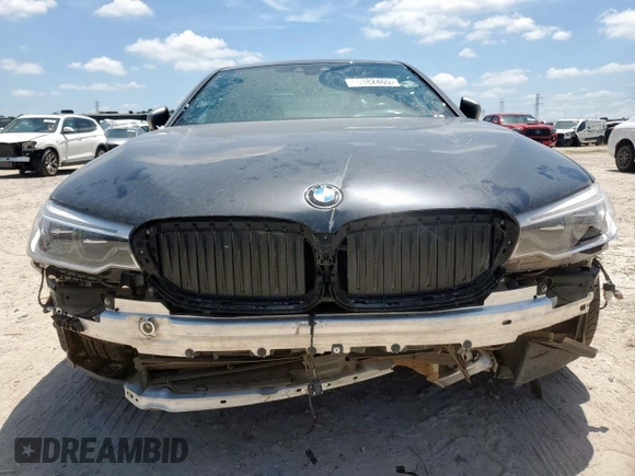 2019 BMW 5 Series M550i xDrive with VIN WBAJB9C51KB287797, listed as a Copart auction lot 65382465 with 61,459 mi miles and Salvage title. Bid and sale history available at DreamBid. Image 5.