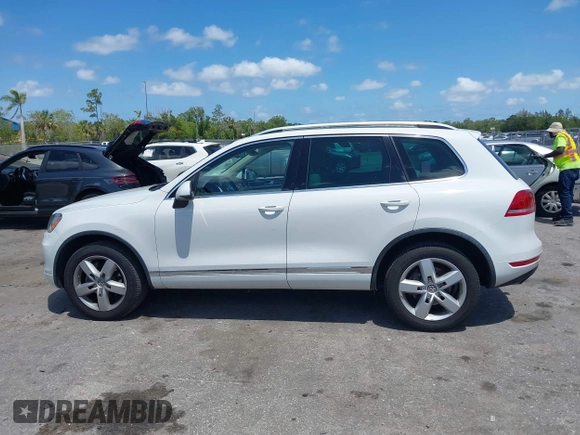 2012 Volkswagen Touareg Sport with VIN WVGEF9BP1CD008717, listed as a IAAI auction lot 42120641 with 211,580 mi miles and . Bid and sale history available at DreamBid. Image 14.