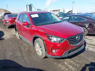 2016 Mazda CX-5 Touring with VIN JM3KE4CY0G0901356, listed as a IAAI auction lot 41641742 with 96,950 mi miles. Bid and sale history available at carsss.com. Image 1.