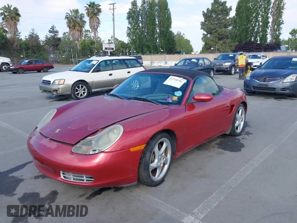 2002 Porsche Boxster z VIN WP0CA29842U621669, wystawiony jako IAAI lot #42218784 z przebiegiem 109 578 mil mil oraz . Historia ofert i sprzedaży dostępna na DreamBid. Obrazek 6.