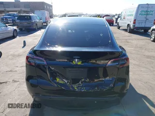 2024 Tesla Model Y Long Range with VIN 7SAYGDEEXRF983040, listed as a IAAI auction lot 41555332 with 79,506 mi miles and . Bid and sale history available at DreamBid. Image 16.