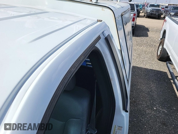 2013 Ford F-150 XL with VIN 1FTMF1CM7DKE57385, listed as a IAAI auction lot 42239910 with 114,245 mi miles and . Bid and sale history available at carsss.com. Image 1.