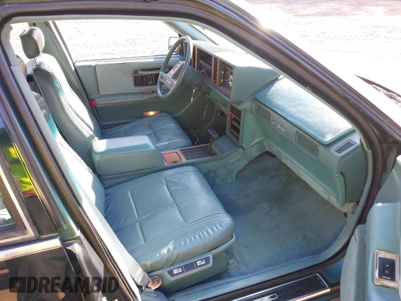 1986 Cadillac Seville z VIN 1G6KS6988GU804079, wystawiony jako IAAI lot #41757149 z przebiegiem 48 807 mil mil oraz . Historia ofert i sprzedaży dostępna na DreamBid. Obrazek 5.