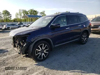 2019 Honda Pilot Touring 8-Passenger z VIN 5FNYF6H90KB000303, wystawiony jako Copart lot #52410585 z przebiegiem 129 190 mil mil oraz Szkoda całkowita • Salvage title. Historia ofert i sprzedaży dostępna na DreamBid. Obrazek 1.
