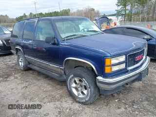 1997 GMC Yukon with VIN 1GKEK13R6VJ715421, listed as a IAAI auction lot 41811398 with 214,735 mi miles. Bid and sale history available at carsss.com. Image 1.