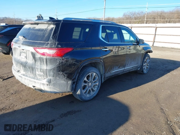 2018 Chevrolet Traverse Premier z VIN 1GNEVJKW5JJ174261, wystawiony jako IAAI lot #41656906 z przebiegiem 101 908 mil mil oraz . Historia ofert i sprzedaży dostępna na DreamBid. Obrazek 4.