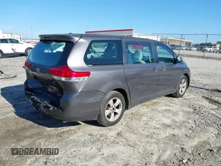 2014 Toyota Sienna L with VIN 5TDZK3DC3ES506658, listed as a IAAI auction lot 41469391 with 169,848 mi miles. Bid and sale history available at carsss.com. Image 4.