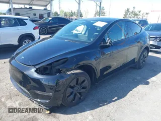 2025 Tesla Model Y Long Range with VIN 7SAYGDEE9SF278607, listed as a IAAI auction lot 41932084 with 9,667 mi miles and . Bid and sale history available at carsss.com. Image 2.