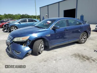 2012 Ford Taurus SEL z VIN 1FAHP2EWXCG144437, wystawiony jako Copart lot #56976035 z przebiegiem 184 475 mil mil oraz Szkoda całkowita • Salvage title. Historia ofert i sprzedaży dostępna na DreamBid. Obrazek 1.