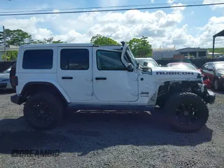 2022 Jeep Wrangler Unlimited Rubicon with VIN 1C4HJXFG8NW130156, listed as a IAAI auction lot 42004630 with 129,313 mi miles and . Bid and sale history available at DreamBid. Image 13.