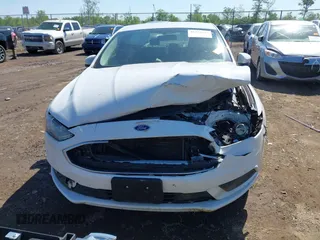 2017 Ford Fusion SE z VIN 3FA6P0H7XHR415299, wystawiony jako IAAI lot #42232634 z przebiegiem 107 962 mil mil oraz . Historia ofert i sprzedaży dostępna na DreamBid. Obrazek 11.