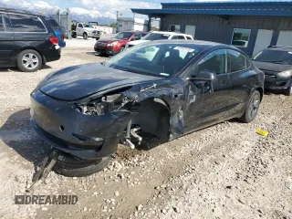 2023 Tesla Model 3 with VIN 5YJ3E1EAXPF708001, listed as a Copart auction lot 57252735 with 71,579 mi miles and Salvage title. Bid and sale history available at DreamBid. Image 1.