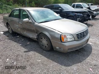 2001 Cadillac DeVille DHS z VIN 1G6KE57Y21U127042, wystawiony jako IAAI lot #41984829 z przebiegiem 73 292 mil mil oraz . Historia ofert i sprzedaży dostępna na DreamBid. Obrazek 1.