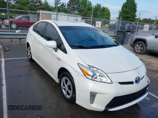 2015 Toyota Prius Four z VIN JTDKN3DU7F1932675, wystawiony jako IAAI lot #42212960 z przebiegiem 137 849 mil mil oraz . Historia ofert i sprzedaży dostępna na DreamBid. Obrazek 1.