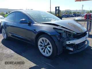 2023 Tesla Model 3 with VIN 5YJ3E1EA2PF640289, listed as a IAAI auction lot 42000200 with 14,194 mi miles and . Bid and sale history available at DreamBid. Image 1.