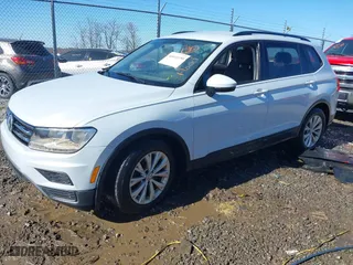 2018 Volkswagen Tiguan S with VIN 3VV1B7AX2JM066312, listed as a IAAI auction lot 41641390 with 133,000 mi miles. Bid and sale history available at carsss.com. Image 2.