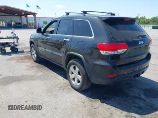 2014 Jeep Grand Cherokee Laredo with VIN 1C4RJEAG9EC157383, listed as a IAAI auction lot 42074411 with 213,566 mi miles and . Bid and sale history available at DreamBid. Image 3.