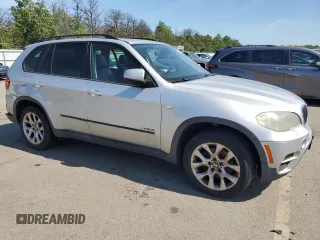 2012 BMW X5 35i with VIN 5UXZV4C5XCL749204, listed as a Copart auction lot 62012985 with 94,636 mi miles and Clean title. Bid and sale history available at DreamBid. Image 4.