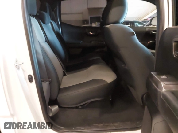 2021 Toyota Tacoma SR z VIN 5TFCZ5AN1MX268370, wystawiony jako IAAI lot #41922632 z przebiegiem 50 358 mil mil oraz . Historia ofert i sprzedaży dostępna na DreamBid. Obrazek 8.