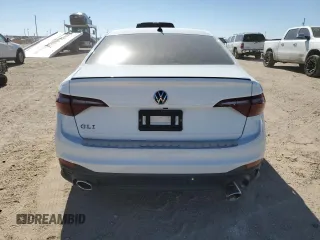 2024 Volkswagen Jetta 40th Anniversary Edition with VIN 3VW8T7BU0RM068373, listed as a Copart auction lot 77764614 with 12,128 mi miles and Salvage title. Bid and sale history available at DreamBid. Image 6.