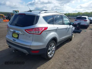 2015 Ford Escape Titanium z VIN 1FMCU9J99FUC75852, wystawiony jako IAAI lot #42171467 z przebiegiem 113 322 mil mil oraz . Historia ofert i sprzedaży dostępna na DreamBid. Obrazek 4.