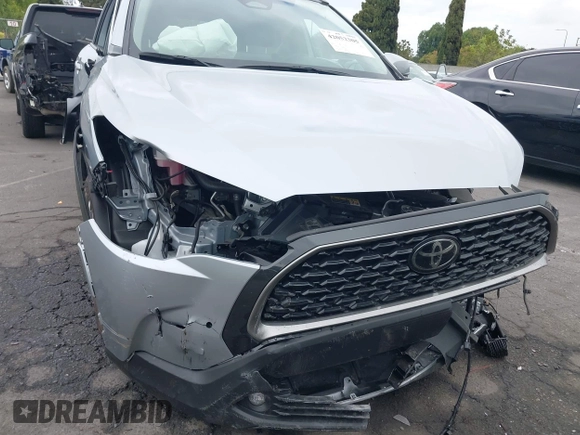 2023 Toyota Corolla Cross XLE with VIN 7MUEAABG8PV077117, listed as a IAAI auction lot 42052305 with 21,571 mi miles and . Bid and sale history available at DreamBid. Image 6.
