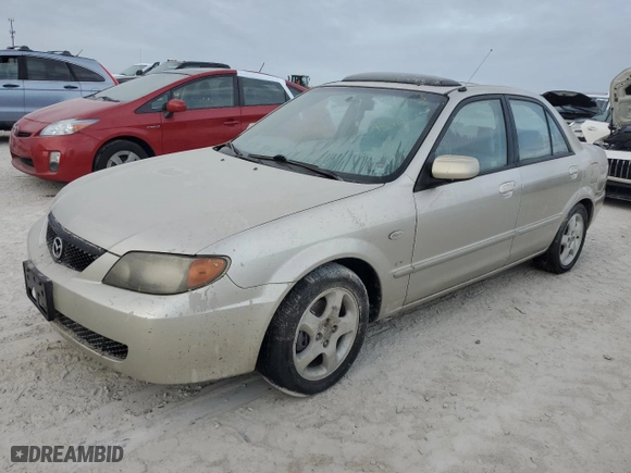 2002 Mazda Protege DX with VIN JM1BJ225321596499, listed as a Copart auction lot 76656714 with 0 mi miles and Salvage Title. Bid and sale history available at carsss.com. Image 1.
