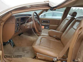 1988 Cadillac Brougham z VIN 1G6DW51Y5J9727006, wystawiony jako Copart lot #70573614 z przebiegiem 34 628 mil mil oraz Szkody całkowita. Historia ofert i sprzedaży dostępna na DreamBid. Obrazek 7.