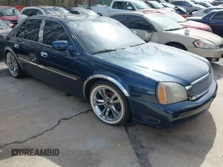 2004 Cadillac DeVille DHS z VIN 1G6KE57Y54U202627, wystawiony jako IAAI lot #41594815 z przebiegiem Nie podano mil oraz . Historia ofert i sprzedaży dostępna na DreamBid. Obrazek 1.
