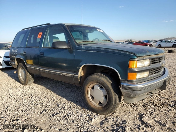 1999 Chevrolet Tahoe Z71 with VIN 1GNEK13R0XJ512661, listed as a Copart auction lot 68022173 with 181,573 mi miles and Salvage Title. Bid and sale history available at carsss.com. Image 4.
