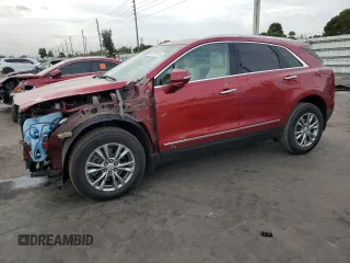 2021 Cadillac XT5 FWD Premium Luxury with VIN 1GYKNCRS7MZ149310, listed as a Copart auction lot 87937445 with 13,829 mi miles and Salvage Title. Bid and sale history available at carsss.com. Image 1.