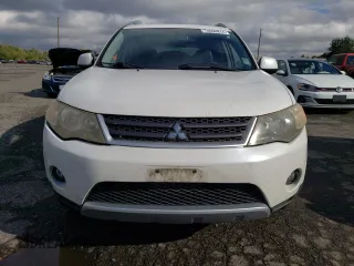 2009 Mitsubishi Outlander SE z VIN JA4MT31W69Z001475, wystawiony jako Copart lot #74098814 z przebiegiem 142 351 mil mil oraz Szkoda całkowita • Salvage title. Historia ofert i sprzedaży dostępna na DreamBid. Obrazek 5.