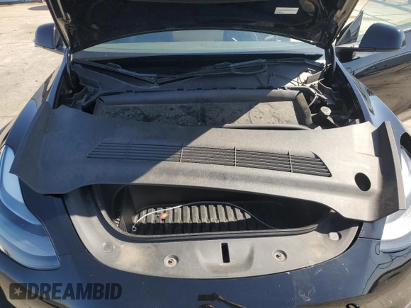 2023 Tesla Model Y Long Range z VIN 7SAYGAEE7PF859030, wystawiony jako Copart lot #58965185 z przebiegiem 18 421 mil mil oraz Czysty tytuł • Clean title. Historia ofert i sprzedaży dostępna na DreamBid. Obrazek 11.
