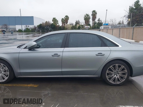 2012 Audi A8 z VIN WAURVAFD5CN008320, wystawiony jako IAAI lot #41508237 z przebiegiem 183 398 mil mil oraz . Historia ofert i sprzedaży dostępna na DreamBid. Obrazek 14.