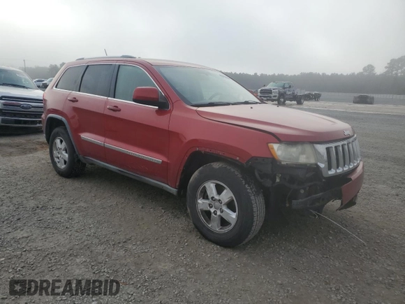 2011 Jeep Grand Cherokee Laredo with VIN 1J4RS4GG6BC704212, listed as a Copart auction lot 83753234 with 200,104 mi miles and Salvage Title. Bid and sale history available at DreamBid. Image 4.