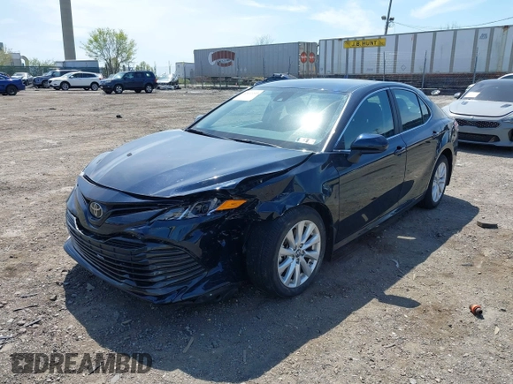 2019 Toyota Camry LE with VIN 4T1B11HK6KU276644, listed as a IAAI auction lot 42037249 with 23,677 mi miles and . Bid and sale history available at DreamBid. Image 6.