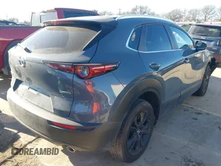 2023 Mazda CX-30 S Carbon Edition z VIN 3MVDMBCM9PM546687, wystawiony jako IAAI lot #41395628 z przebiegiem 13 878 mil mil oraz . Historia ofert i sprzedaży dostępna na DreamBid. Obrazek 4.
